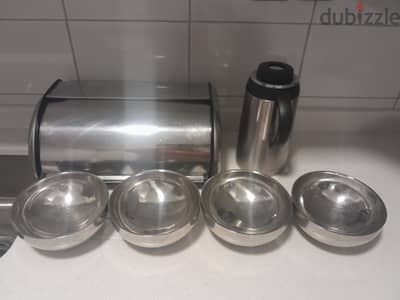 Stainless steel bread box,flask and 4 bowls.