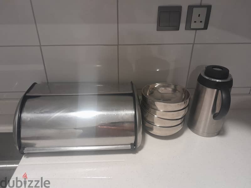 Stainless steel bread box,flask and 4 bowls. 1