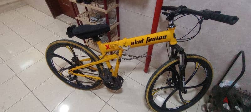 Skid Fusion foldable and gear cycle yellow colour with seat cover 0