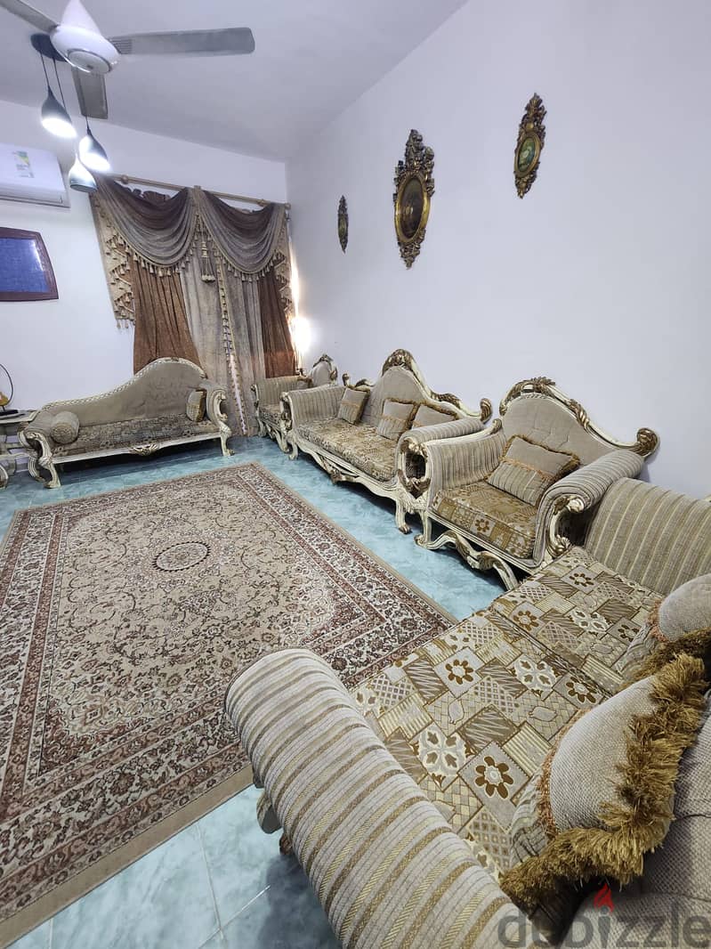 9 seater sofa with 2 side tables and curtain  750 riyal 0