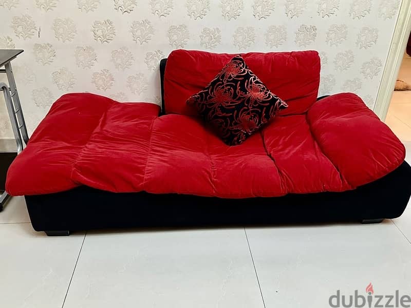 A very well maintained Red sofa 0