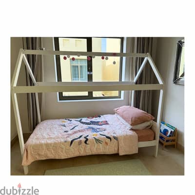 Children's white wooden hut bed