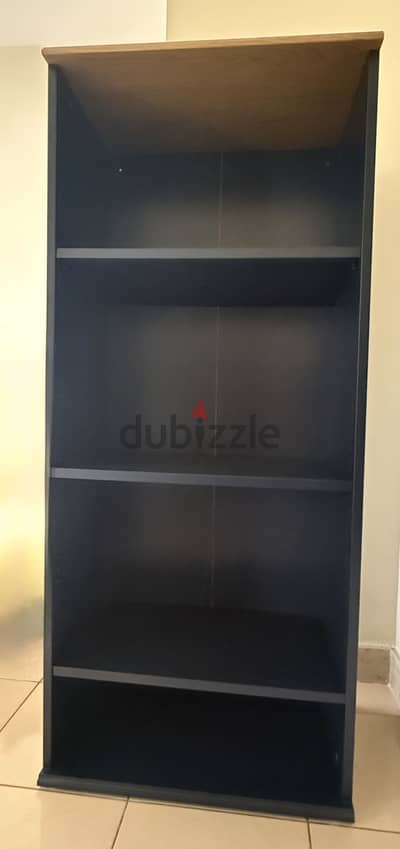 Navy blue bookshelf / storage unit in very good condition.