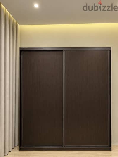 Elegant and spacious dark wood Closet