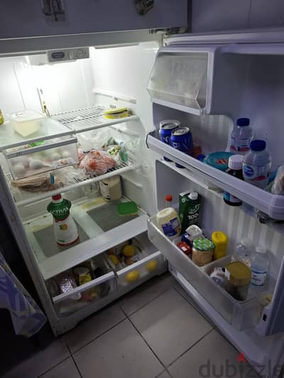 white refrigerator/freezer in a very good working condition