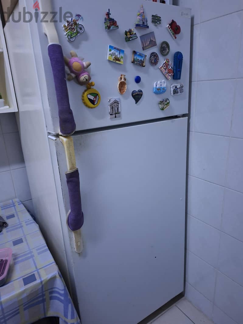 white refrigerator/freezer in a very good working condition 2