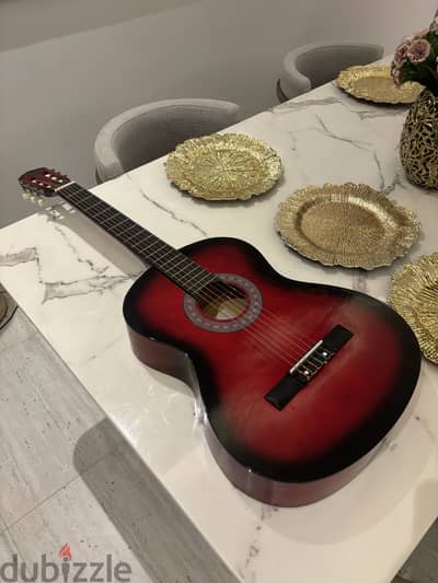 Red acoustic guitar.