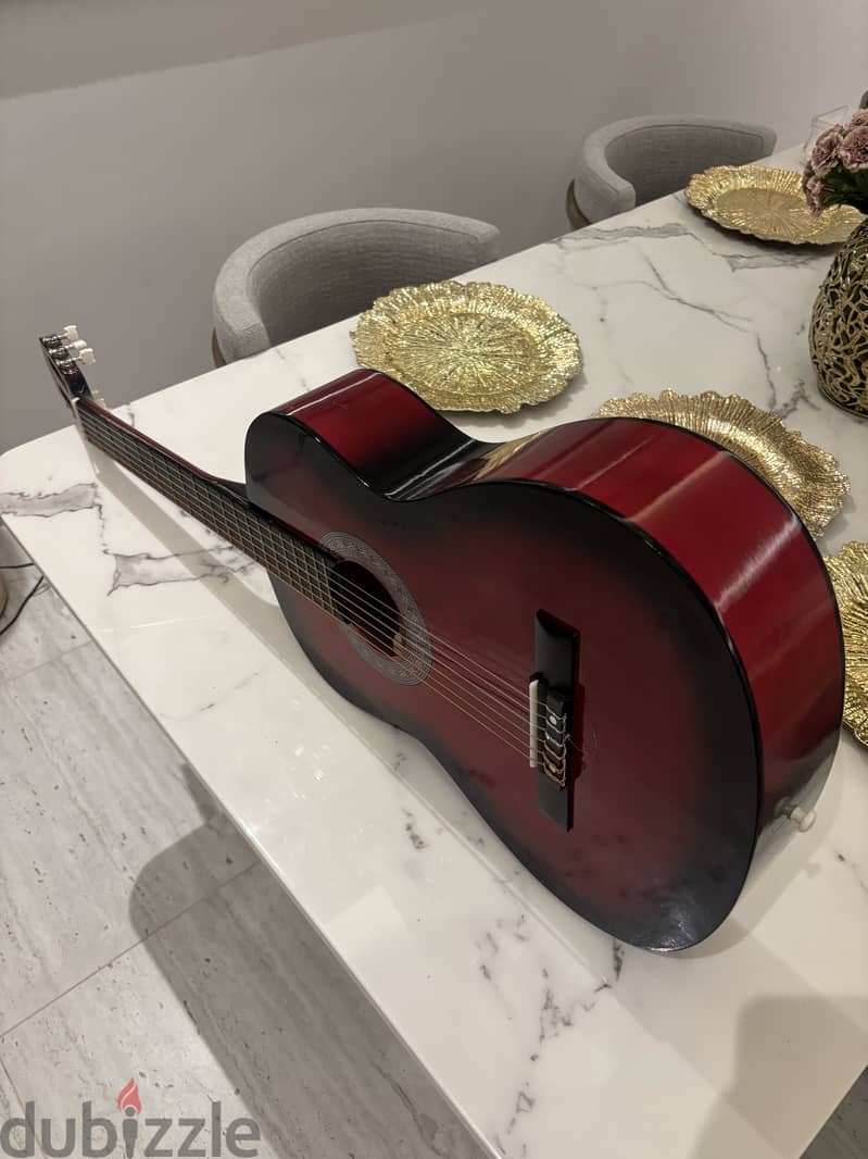 Red acoustic guitar. 1